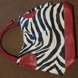 Red white and black zebra handbag. Roomy with lots of space to hold your things.